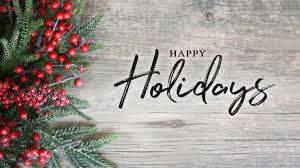 A rustic wooden background with a decorative border of green evergreen branches and bright red winter berries on the left, featuring the text HAPPY Holidays centered in a black script font.