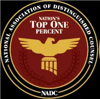 A circular emblem with a gold eagle and scales, laurel branches, and the text: Nations Top One Percent, National Association of Distinguished Counsel, NADC.