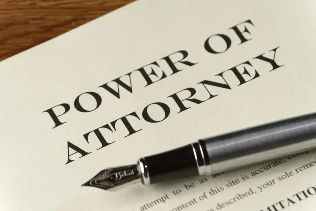 Document titled "Power of Attorney" with legal text and signatures, indicating authority granted to another individual.