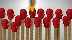 An illustration features rows of matchsticks where the red tips are shaped like human heads facing right. One matchstick in the center is lit, with its head-shaped tip actively burning in a small orange flame.