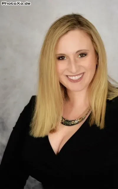 A professional headshot of Share-Lynn Cuomo Shore.