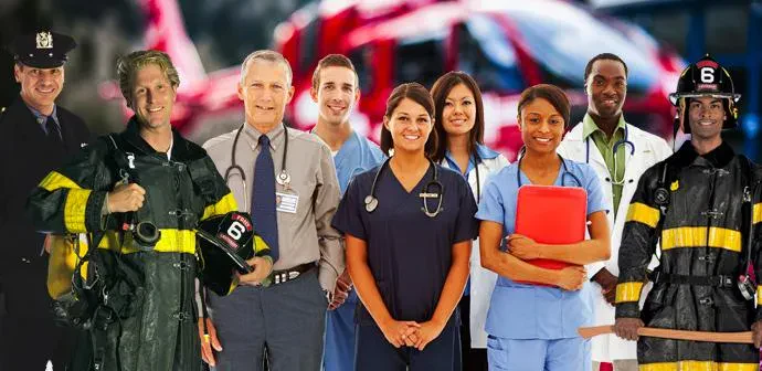 A diverse group of fire and emergency service personnel standing together, showcasing teamwork and dedication to public safety.