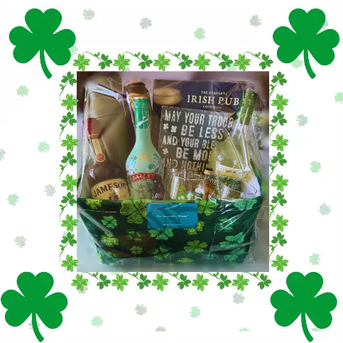 A St. Patricks Day gift basket with drinks, snacks, and a sign, surrounded by green shamrocks and a white background decorated with clovers.
