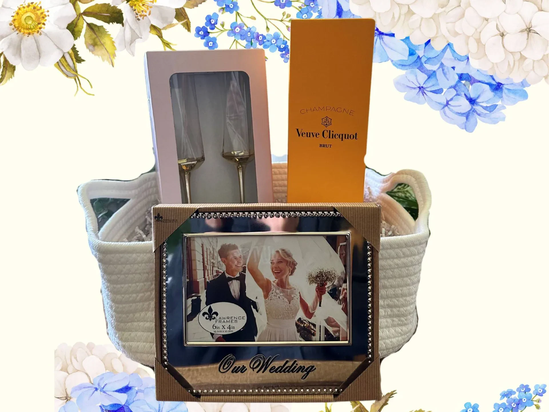 A gift basket made of white woven rope contains wedding-themed gifts against a cream background decorated with light blue and white flowers.