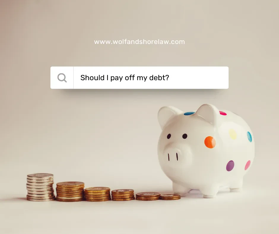 An eye-level shot shows a white piggy bank with colorful polka dots, facing right, next to a line of descending coin stacks on a beige surface.