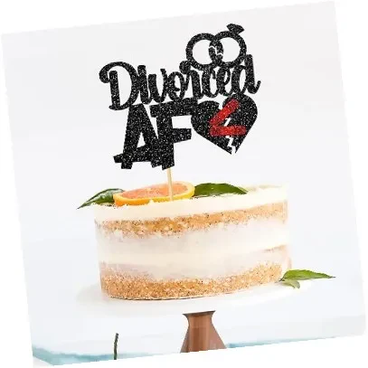 A cake decorated with the word "divorced" written in icing, symbolizing a celebration of newfound freedom.