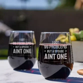 Two wine glasses with the text, "I don't have any problems but I'm not an one," displayed prominently between them.