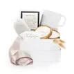 An elegant gift box ensemble featuring a white mug, a framed sign, a packaged loofah or soap sponge, a round wooden coaster, dried bunny tail grass accents, a satin ribbon draping down the side, and a personalized gift card.