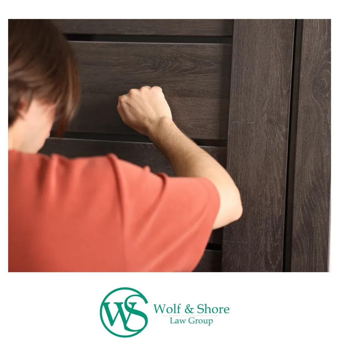 A man knocks on a door.